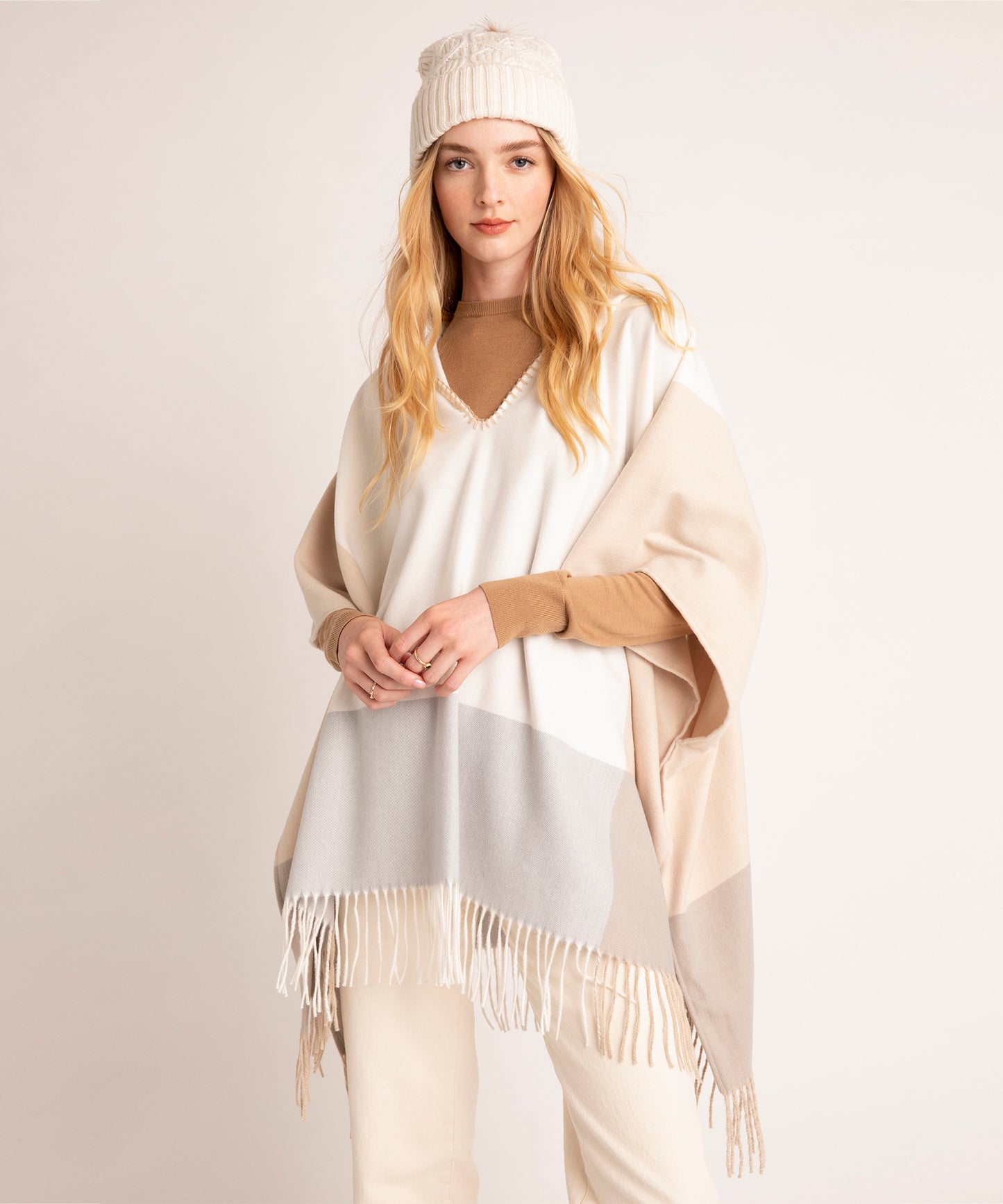 Poet Poncho in color Cream on a model